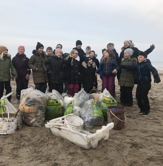 School class on the stretch collecting waste